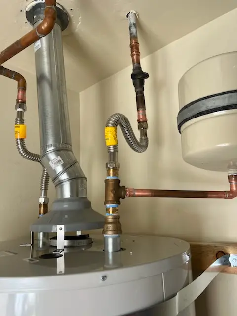 Water heater installation and plumbing repair in McNeil
